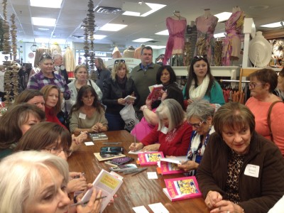 Authors sign their books at the launch party